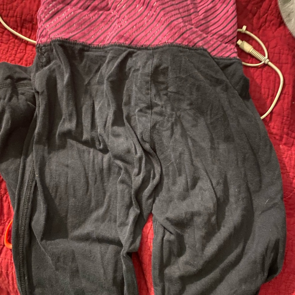 Lil wrinkled but comfy pants pink and black in size small